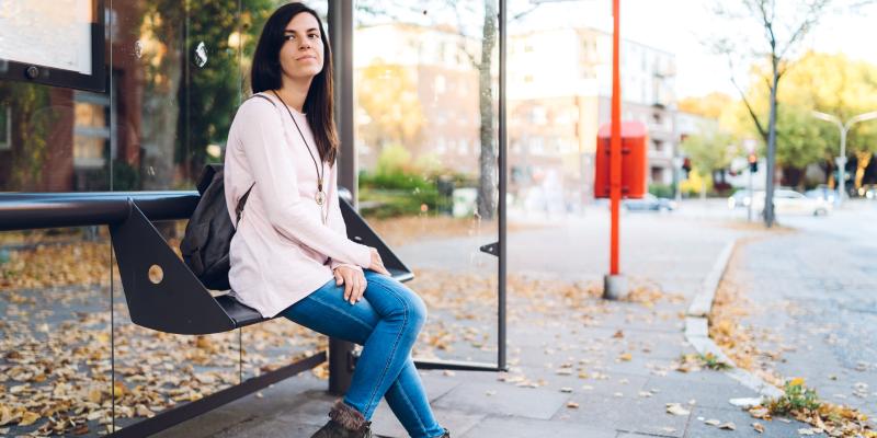 Woman waiting for bus to work