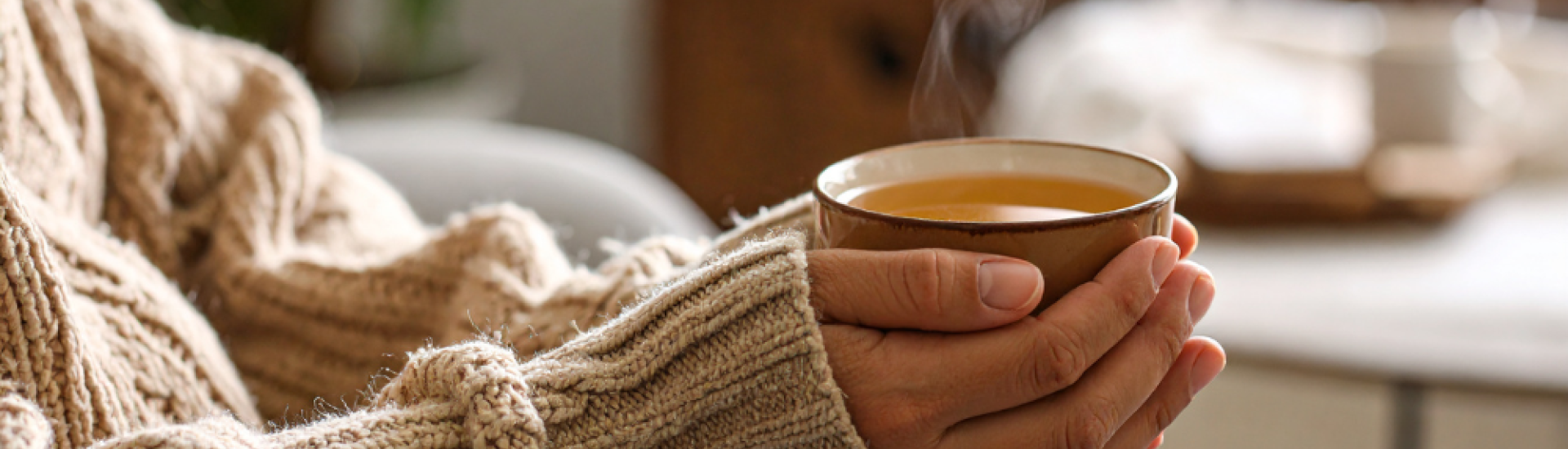 someone holding a hot drink