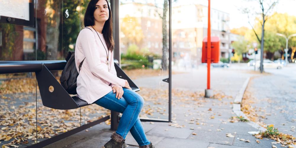 Woman waiting for bus to work